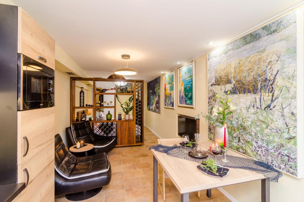 a living room with a table and chairs at Apartment City Getaway in Dubrovnik
