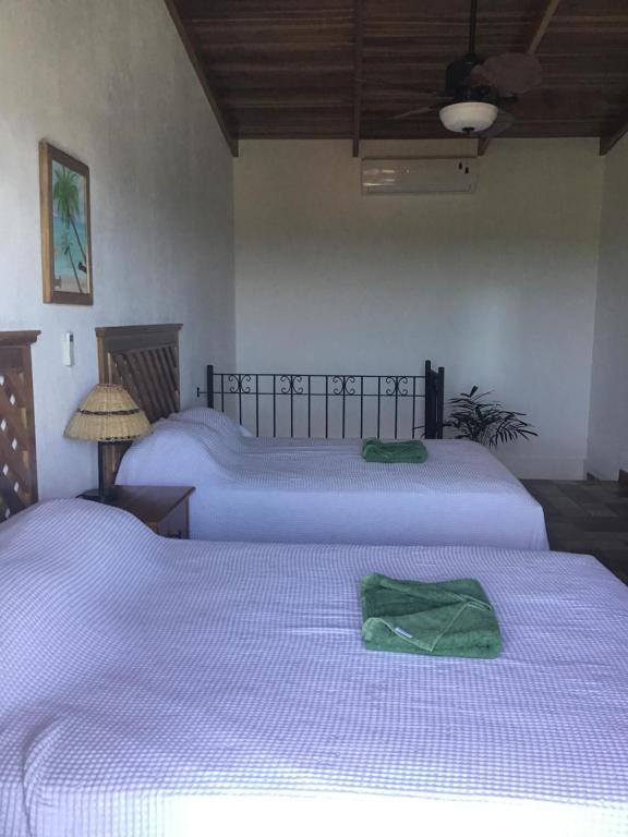 Postel nebo postele na pokoji v ubytování Hotel Los Cielos Del Caribe