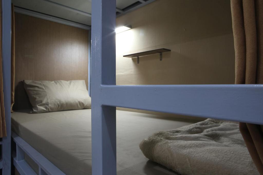 Una cama o camas en una habitación de Aru House Ubud