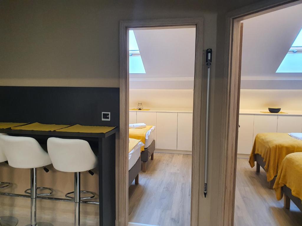 Posteľ alebo postele v izbe v ubytovaní Kaposvár Apartman
