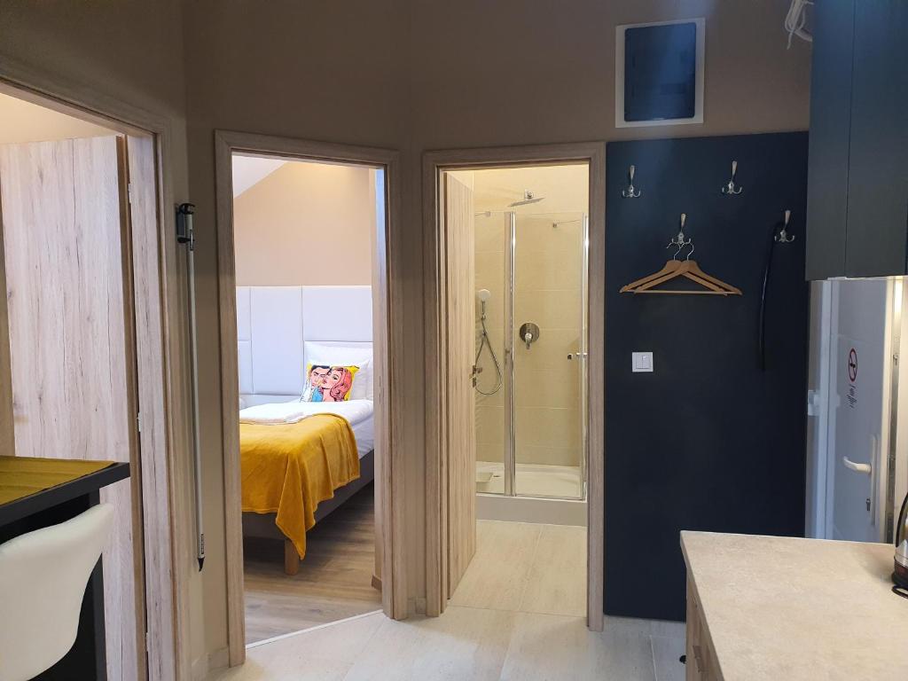 Posteľ alebo postele v izbe v ubytovaní Kaposvár Apartman