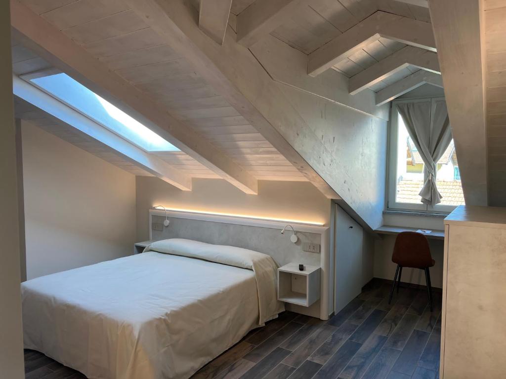 Postel nebo postele na pokoji v ubytování Osteria Senza Fretta Rooms for Rent
