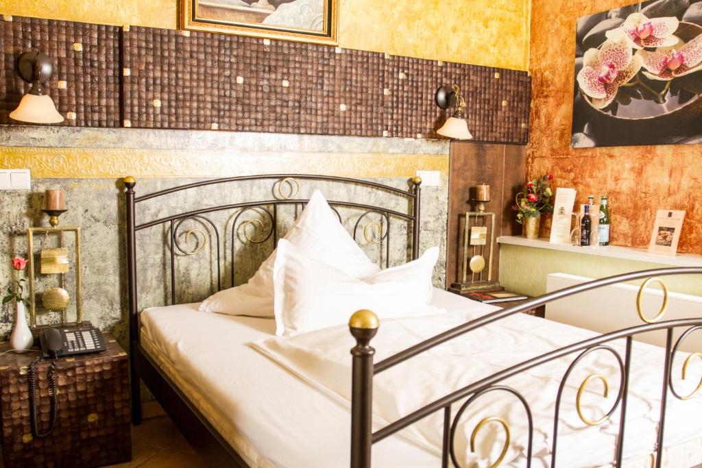 Postel nebo postele na pokoji v ubytování Hotel Don Giovanni