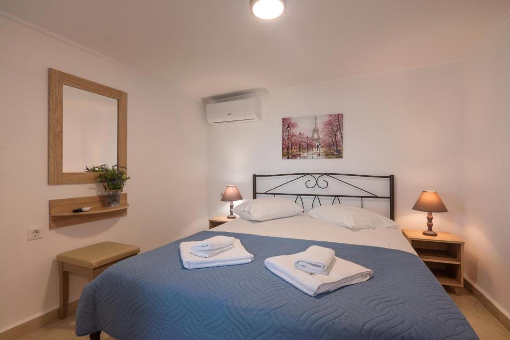 Posteľ alebo postele v izbe v ubytovaní Calliope Rooms