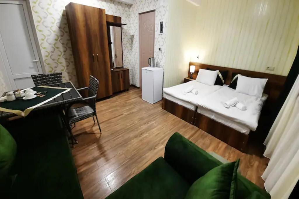 Postel nebo postele na pokoji v ubytování Hotel Goldenera
