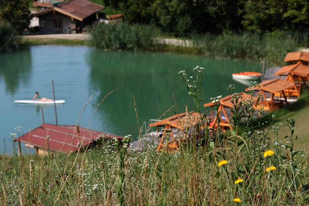 a person on a surfboard in the water at Ferienhof Mühlthal in Edling