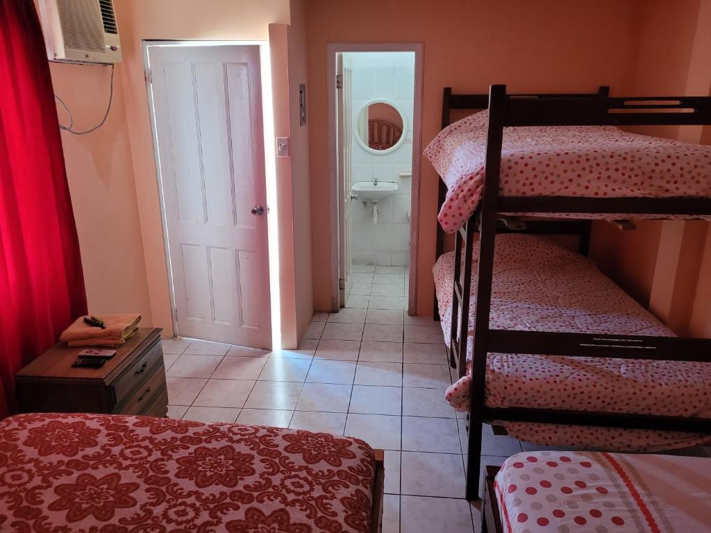 Postel nebo postele na pokoji v ubytování Hostal Haziel