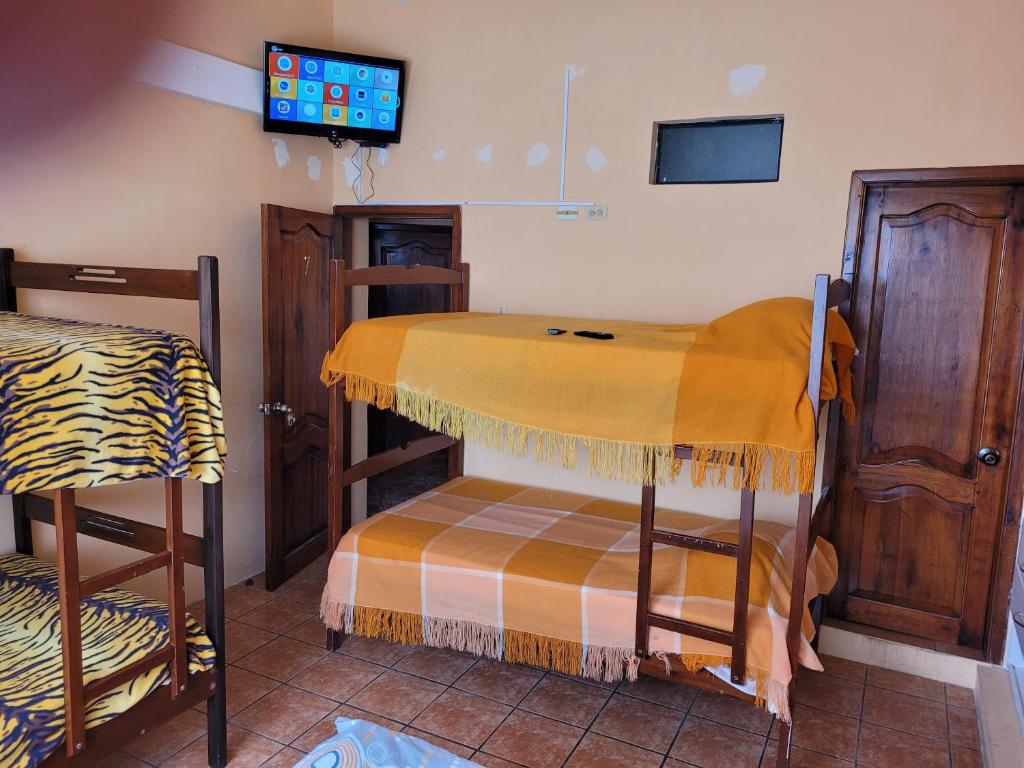 Postel nebo postele na pokoji v ubytování Hostal Haziel