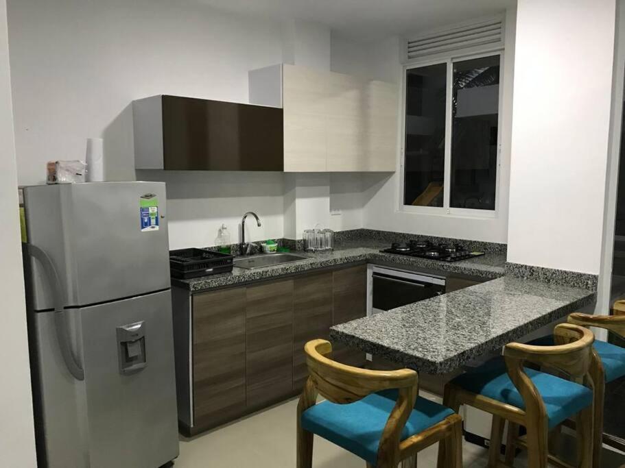 Kuchyň nebo kuchyňský kout v ubytování Casa de Playa frente al mar.