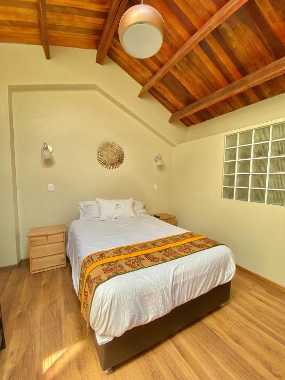 Postel nebo postele na pokoji v ubytování Hostal Casona Arrambide