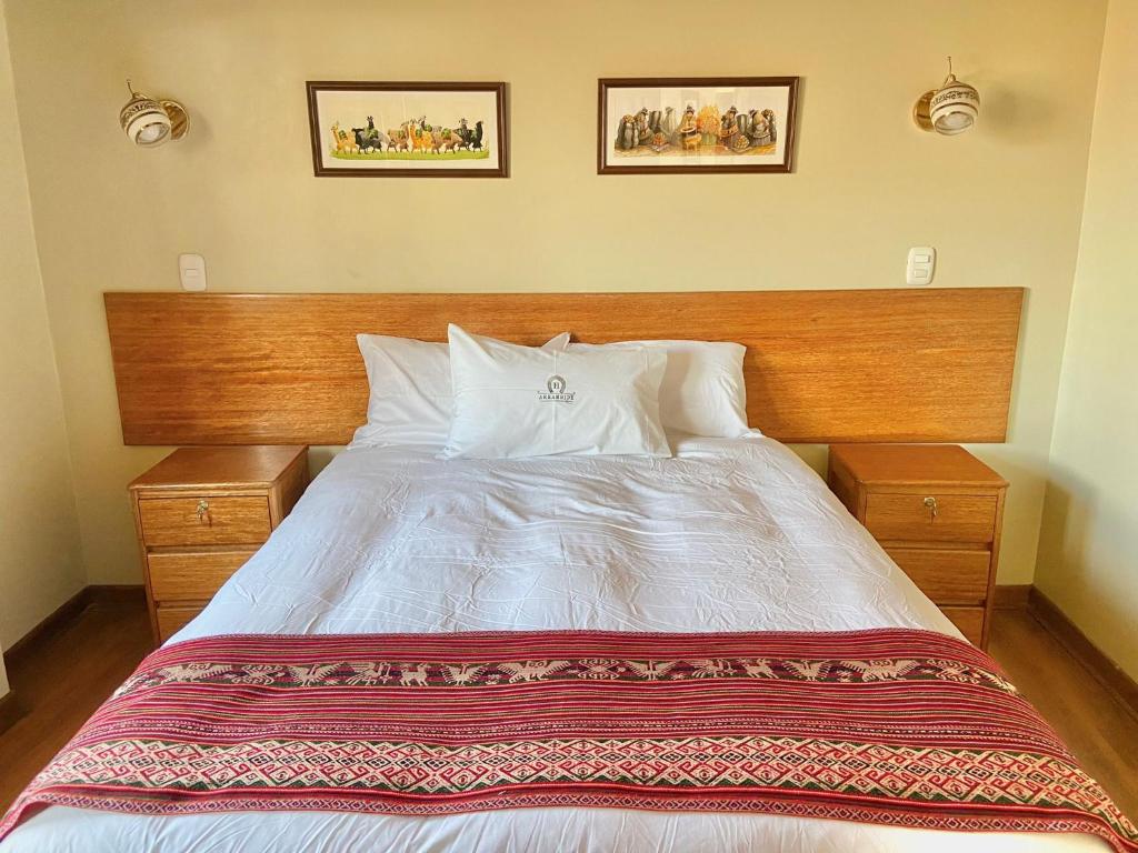 Postel nebo postele na pokoji v ubytování Hostal Casona Arrambide