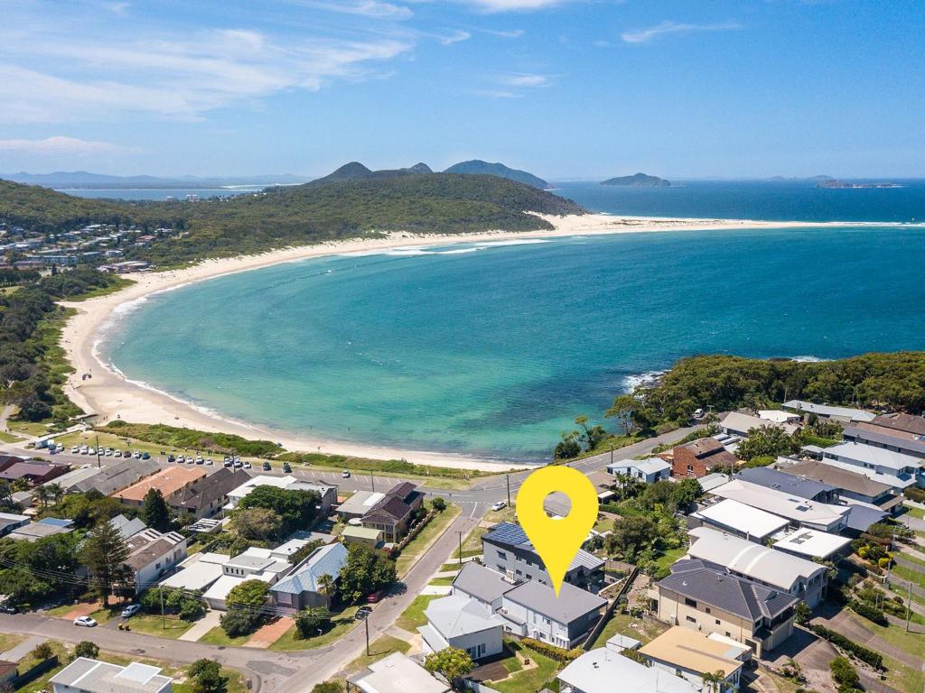 an aerial view of a beach with a yellow arrow at Fingal Bay Seabreeze Unit 2 16 Tuna Crescent in Fingal Bay
