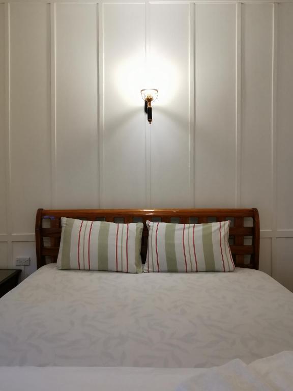 Postel nebo postele na pokoji v ubytování TAVEE Guesthouse
