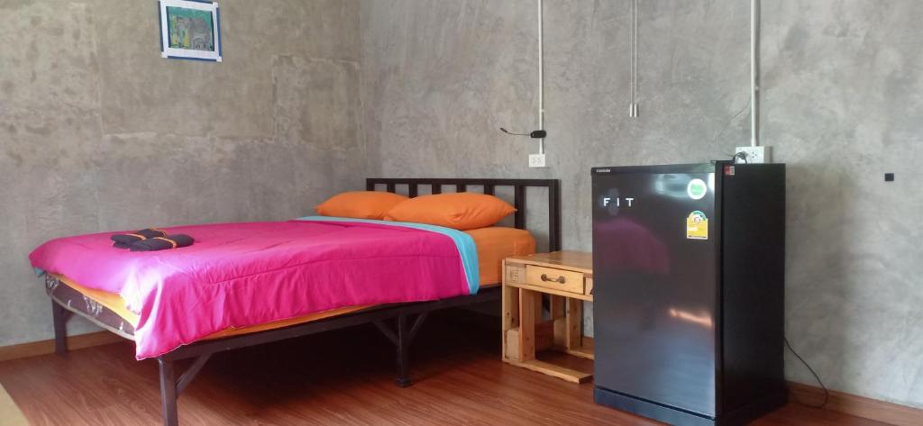 Postel nebo postele na pokoji v ubytování Koh Mak Homestay
