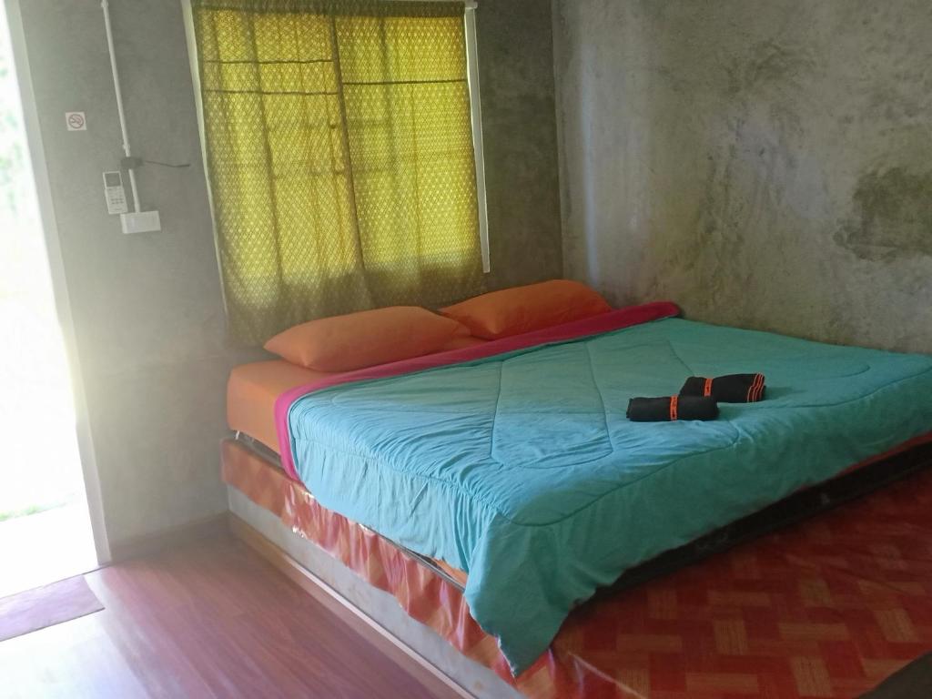 Postel nebo postele na pokoji v ubytování Koh Mak Homestay