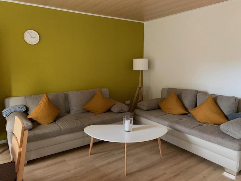 a living room with a couch and a table at Ferienwohnung Birka in Speyer