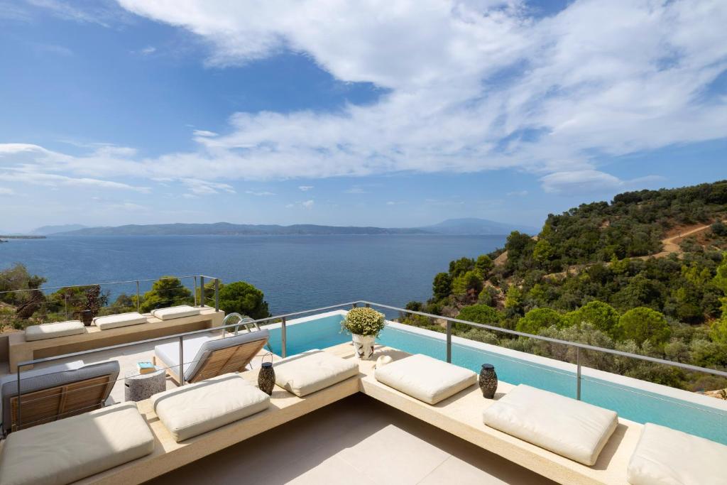 a view of the ocean from the balcony of a house at Kechria Bay Villas in Skiathos