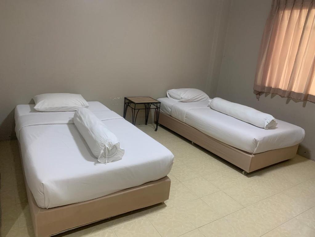 Postel nebo postele na pokoji v ubytování Lithai Guesthouse