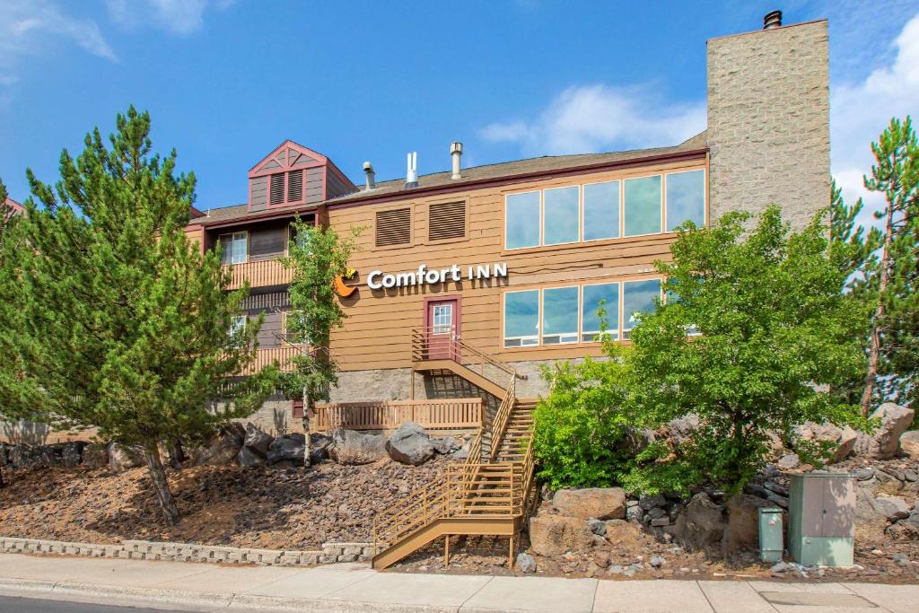 a home with a sign that reads campari inn at Comfort Inn I-17 & I-40 in Flagstaff