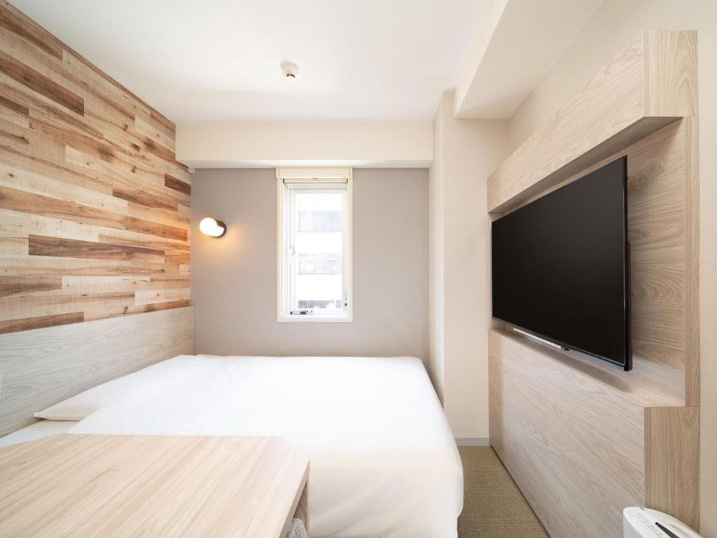 TV a/nebo společenská místnost v ubytování Super Hotel Shinagawa Aomono-Yokocho