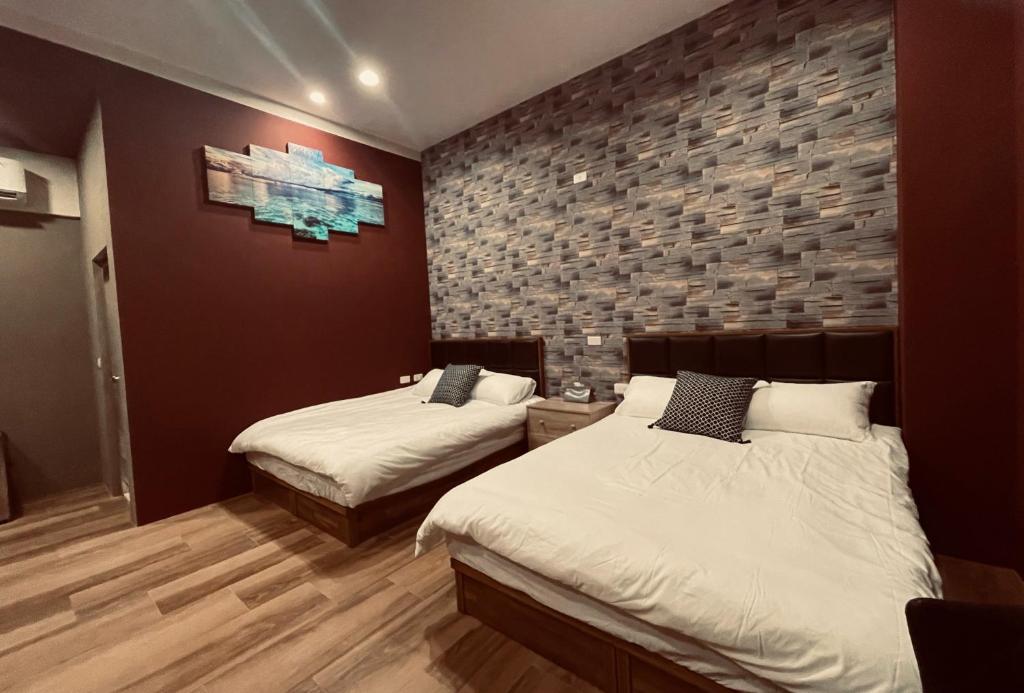 Postel nebo postele na pokoji v ubytování 鄉間小路 Home 備有專屬停車場