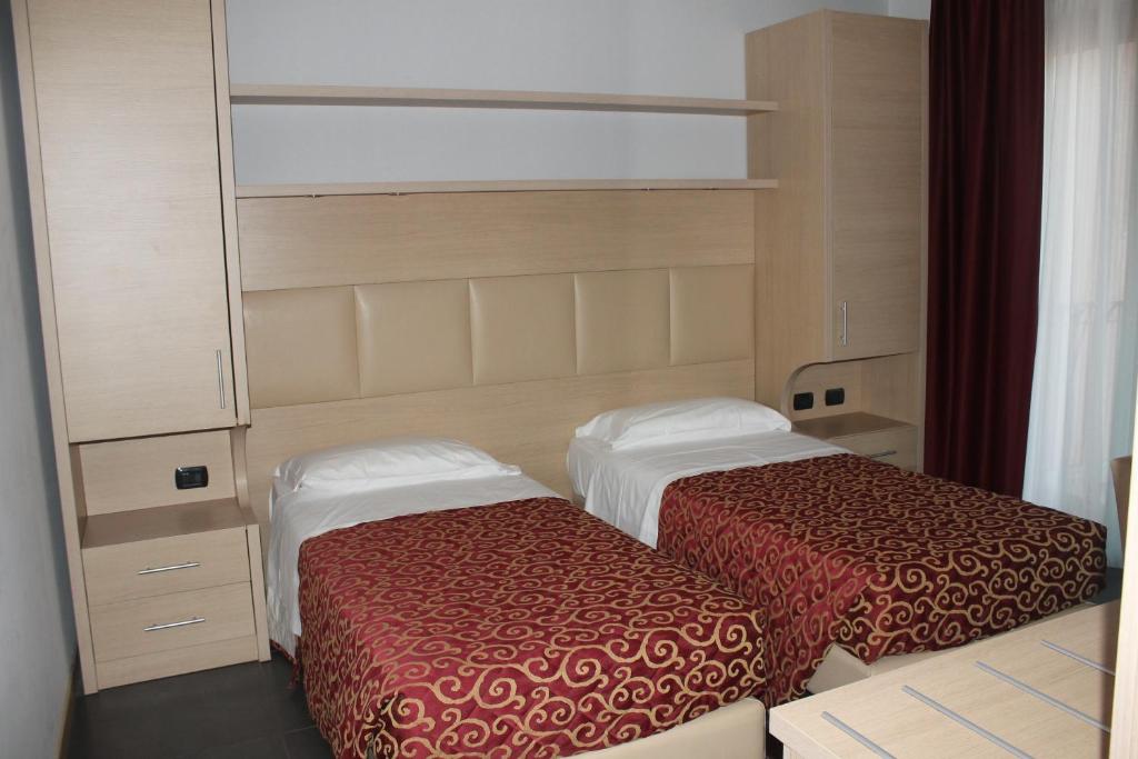 Postel nebo postele na pokoji v ubytování Hotel Eridano