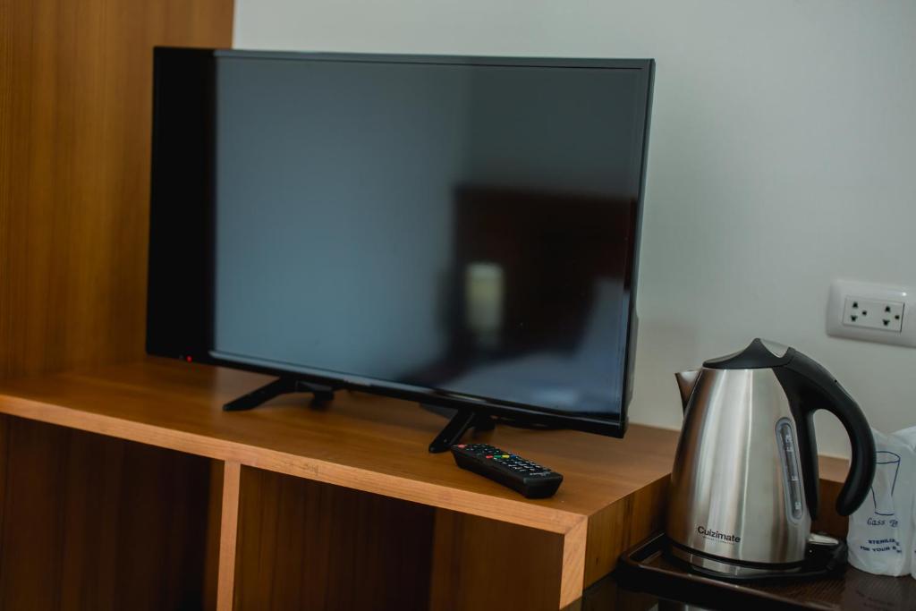 TV a/nebo společenská místnost v ubytování Aim House