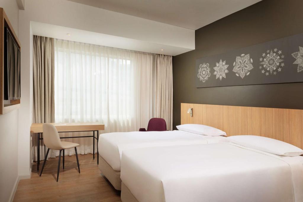 Postel nebo postele na pokoji v ubytování Park Inn By Radisson Clark