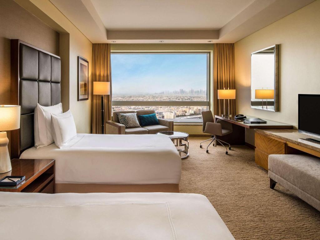 Postel nebo postele na pokoji v ubytování Swissôtel Al Ghurair Dubai - Deira & Creek