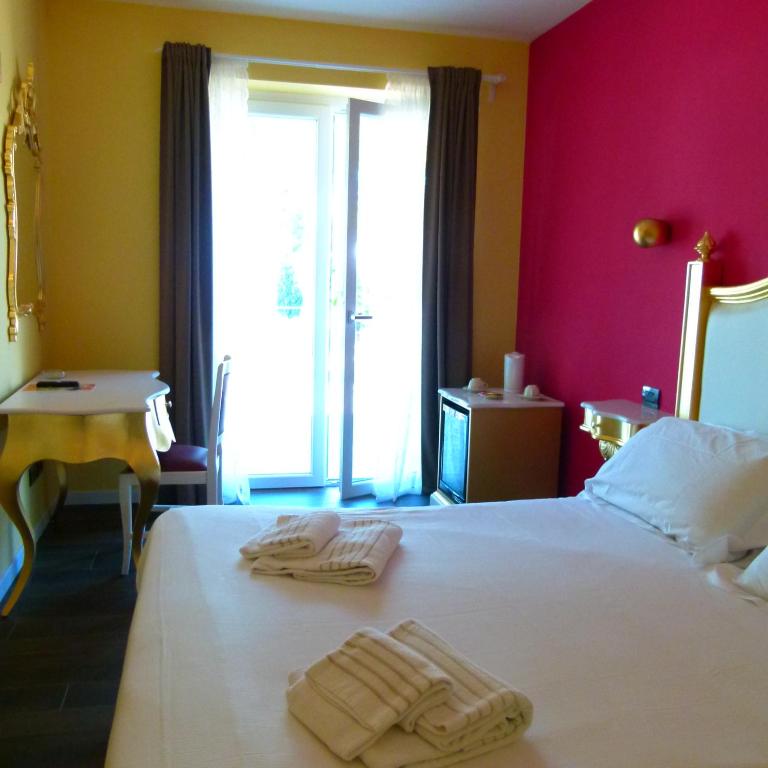 Postel nebo postele na pokoji v ubytování Boutique Hotel Bel Sito Wellness & Private SPA