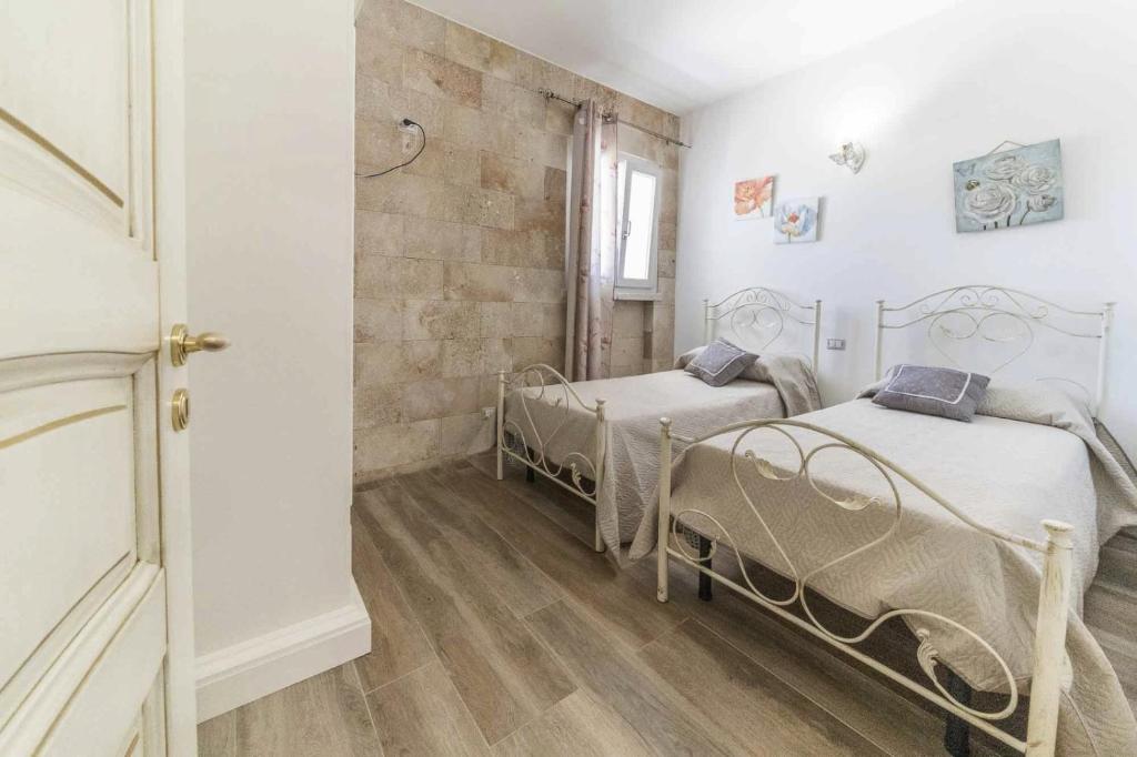 Postel nebo postele na pokoji v ubytování Villa Salux by HDSalento
