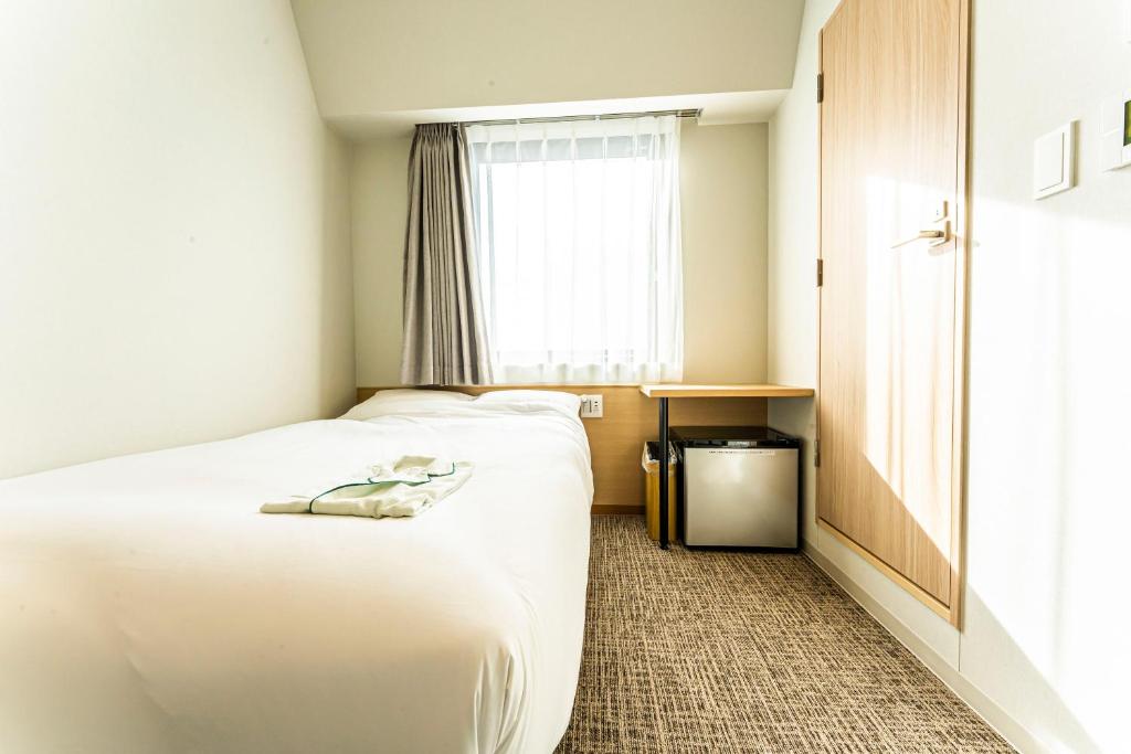 Postel nebo postele na pokoji v ubytování CVS Bay Hotel
