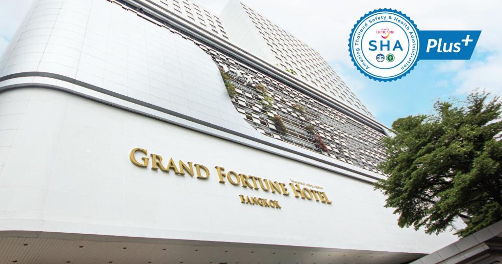 a sign on the front of the grand toronto centre at Grand Fortune Hotel Bangkok in Bangkok