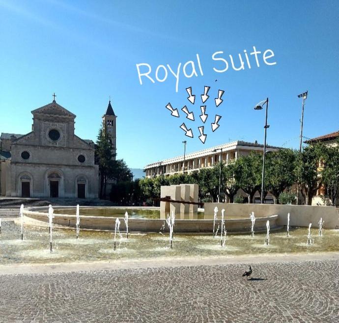 a group of birds standing in front of a building at Royal Suite in Avezzano