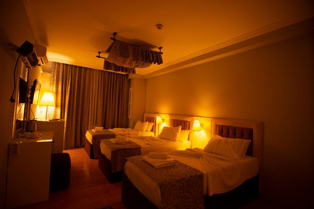 Postel nebo postele na pokoji v ubytování SRF Hotel
