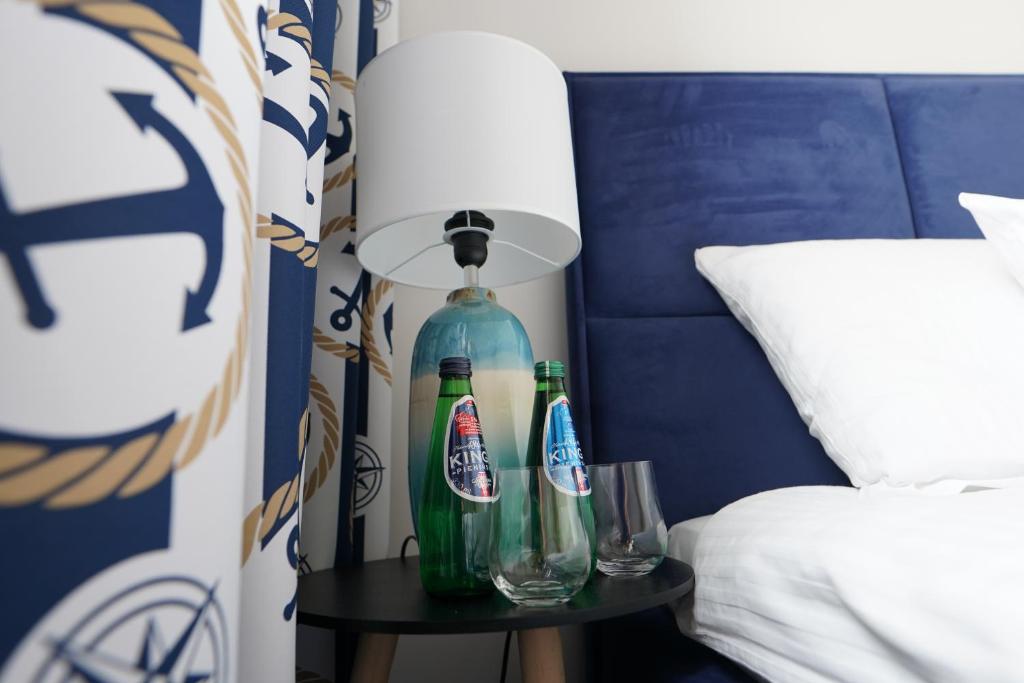 Postel nebo postele na pokoji v ubytování Lemmas Apartament Anchoria
