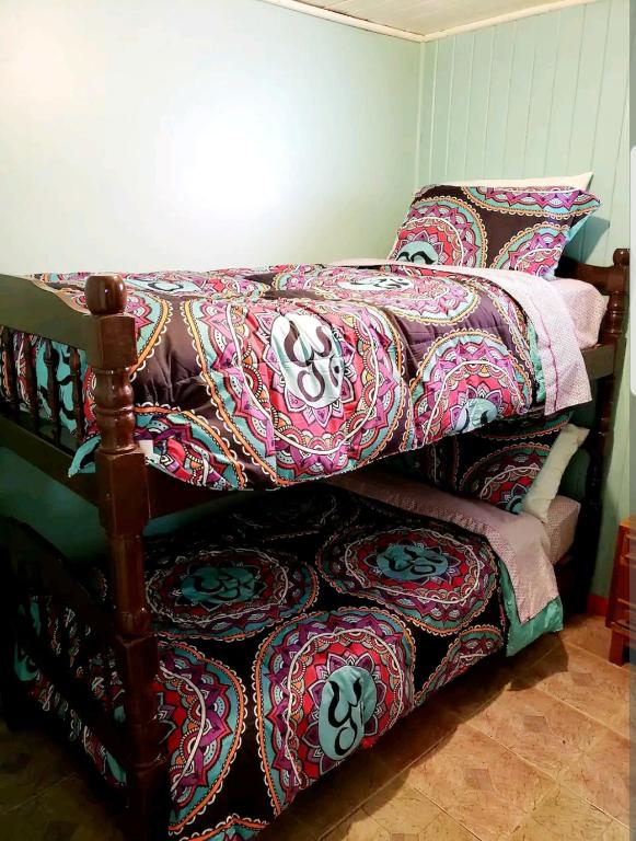 Postel nebo postele na pokoji v ubytování Casa con Tinaja Caliente, Quincho y Pet Friendly