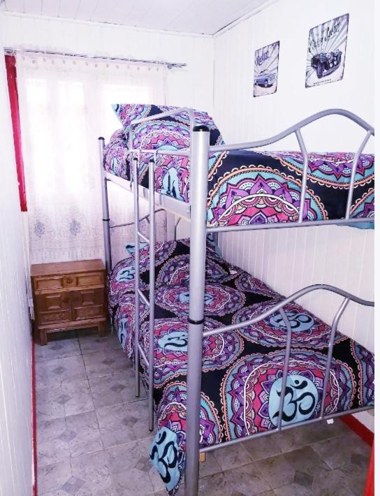 Postel nebo postele na pokoji v ubytování Casa con Tinaja Caliente, Quincho y Pet Friendly