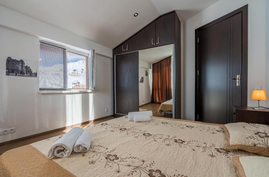 Postel nebo postele na pokoji v ubytování 2-room Apartment NFT Gudauri 303