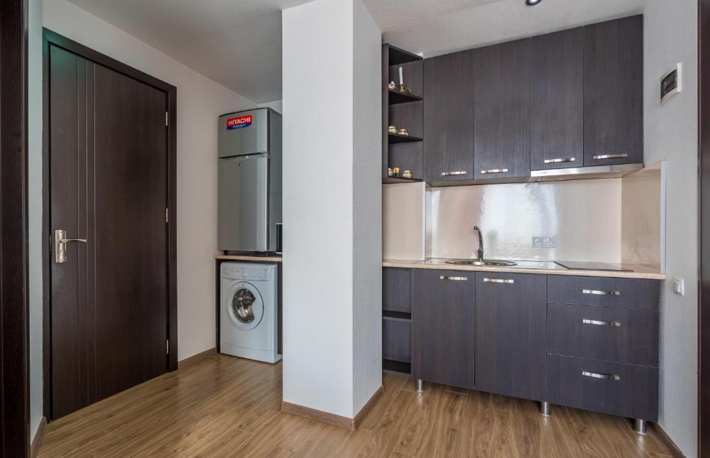Kuchyň nebo kuchyňský kout v ubytování 2-room Apartment NFT Gudauri 303