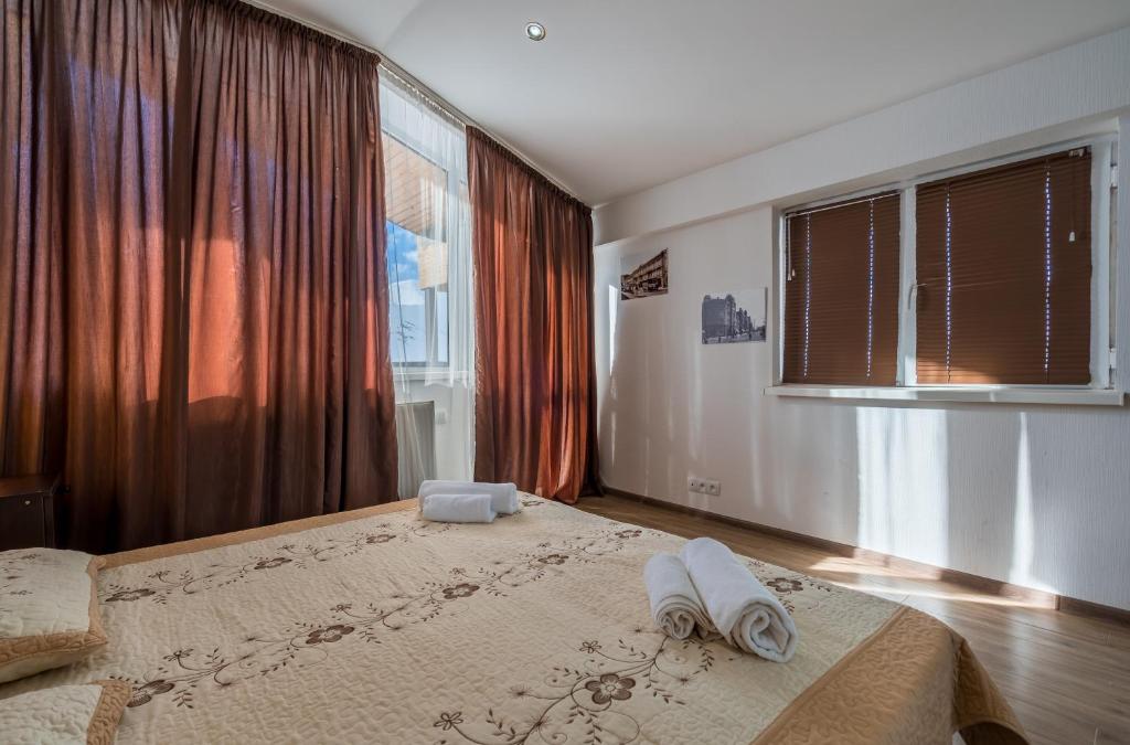 Postel nebo postele na pokoji v ubytování 2-room Apartment NFT Gudauri 303