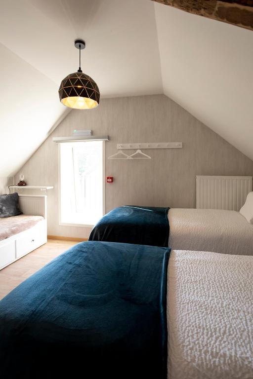 Postel nebo postele na pokoji v ubytování Enjoytoday 49 - Luxueus familieverblijf aan de voet van de Koppenberg