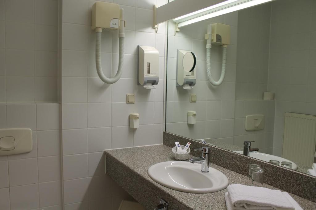 Koupelna v ubytování Hotel Chassalla