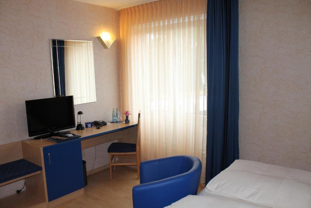 TV a/nebo společenská místnost v ubytování Hotel Chassalla