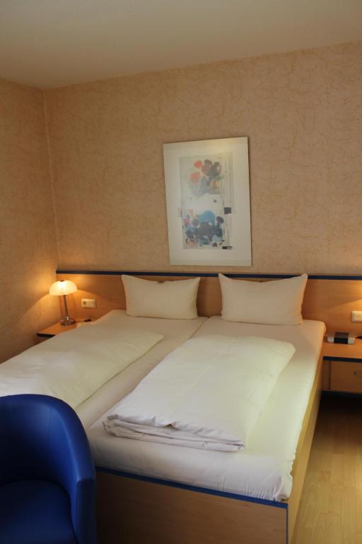 Postel nebo postele na pokoji v ubytování Hotel Chassalla
