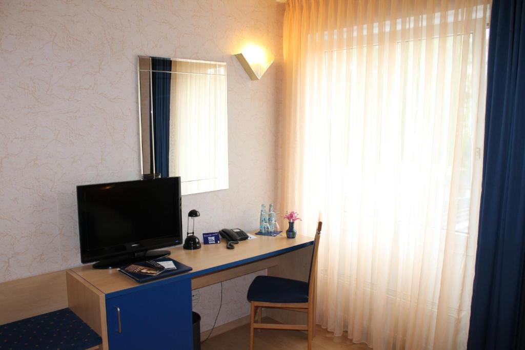 TV a/nebo společenská místnost v ubytování Hotel Chassalla