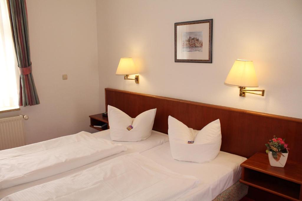 Postel nebo postele na pokoji v ubytování Hotel Fürsteneck