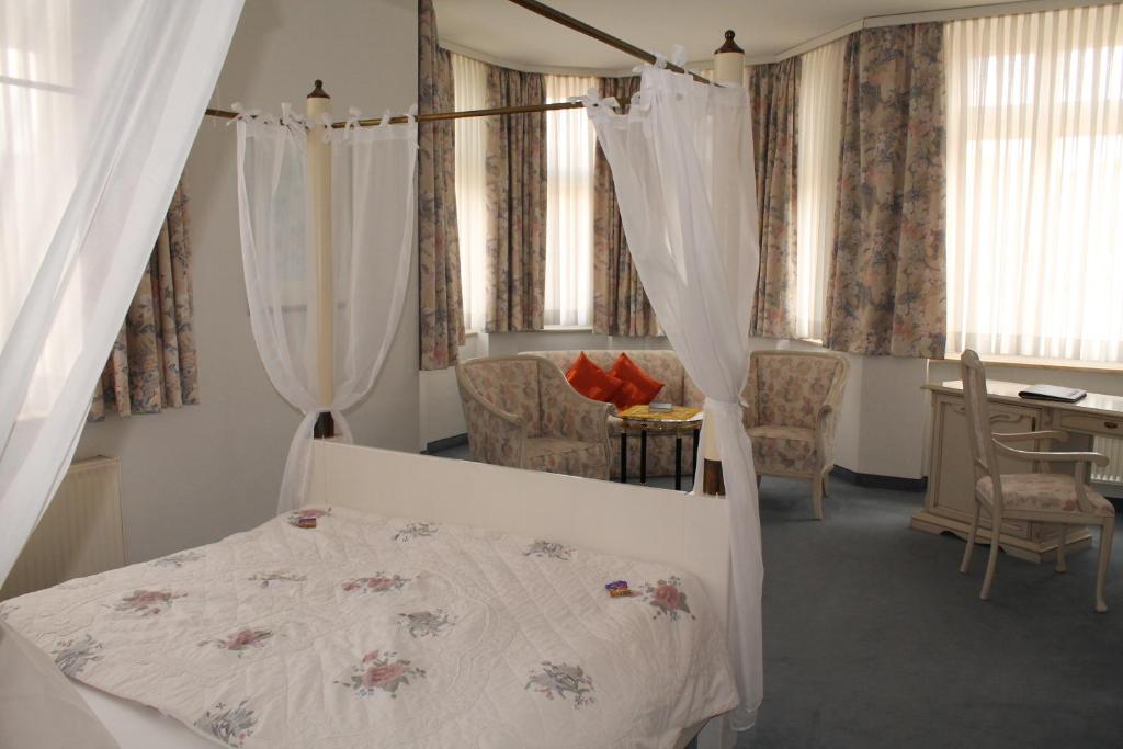 En eller flere senge i et værelse på Hotel Fürsteneck