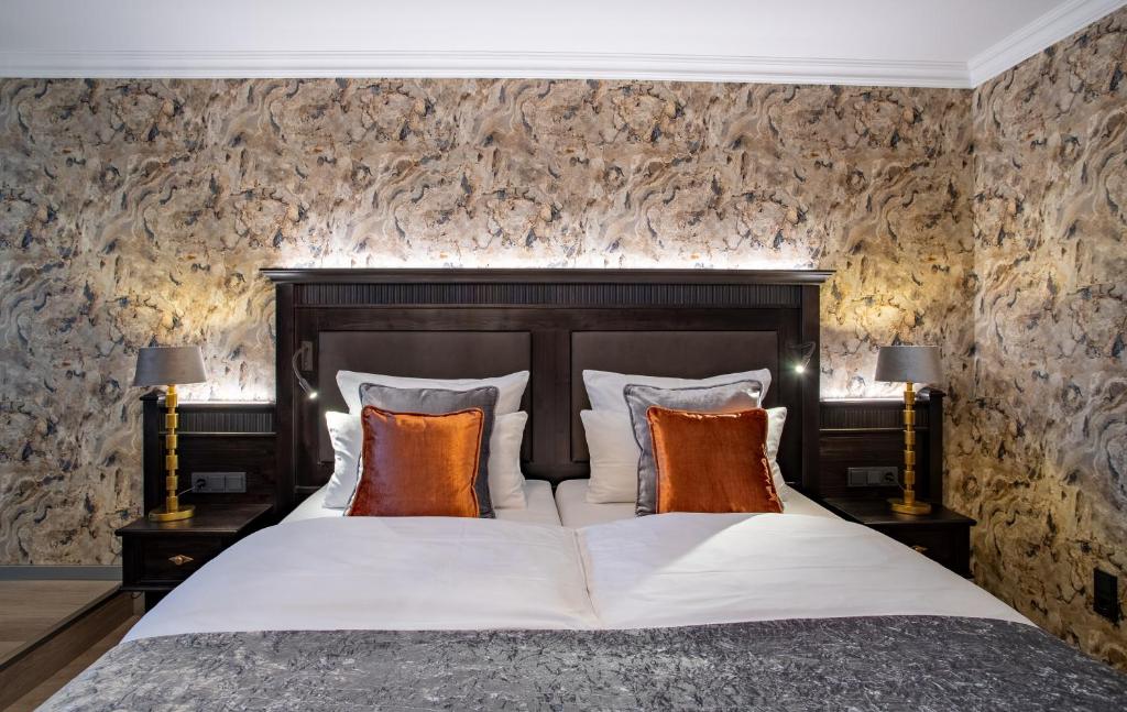 Cama ou camas em um quarto em Villa Westend Hotel an der Messe