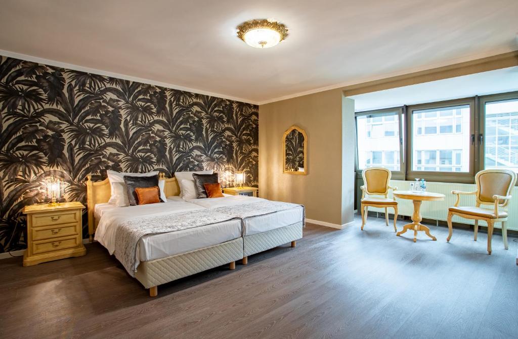 Cama ou camas em um quarto em Villa Westend Hotel an der Messe